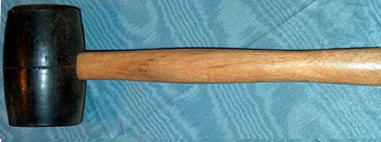  A rubber mallet, used in construction, woodworking, and auto-body work.